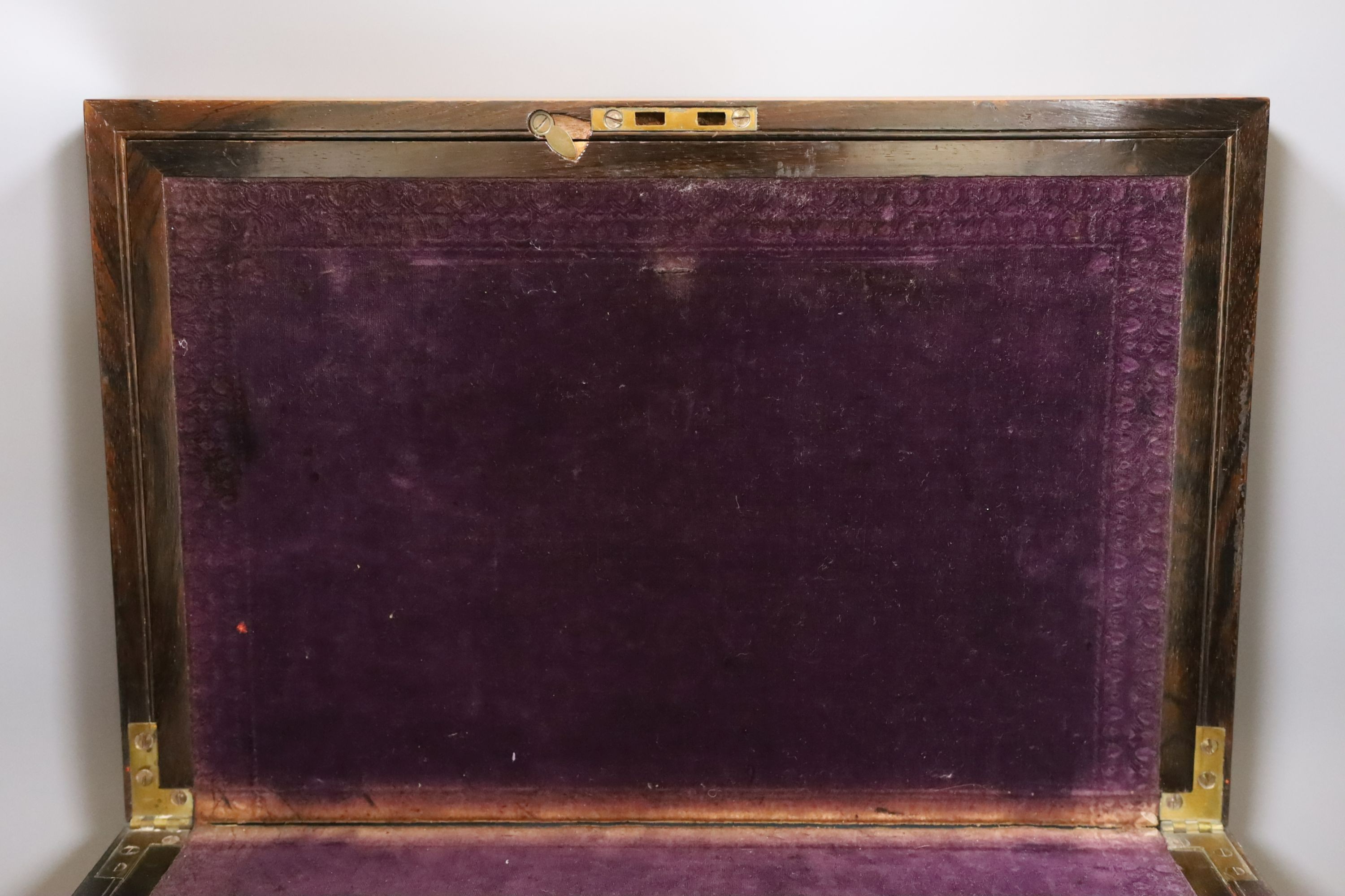 A Victorian birds eye maple and rosewood writing slope, 44.5 cms wide x 14 cms high.